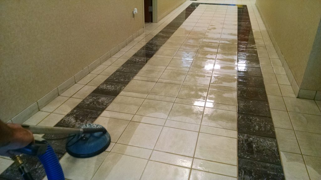 A floor cleaning machine is on the ground.